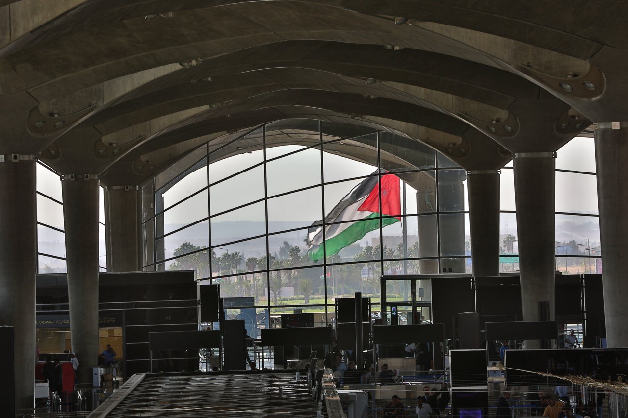 Queen Alia International Airport terminal at sunset